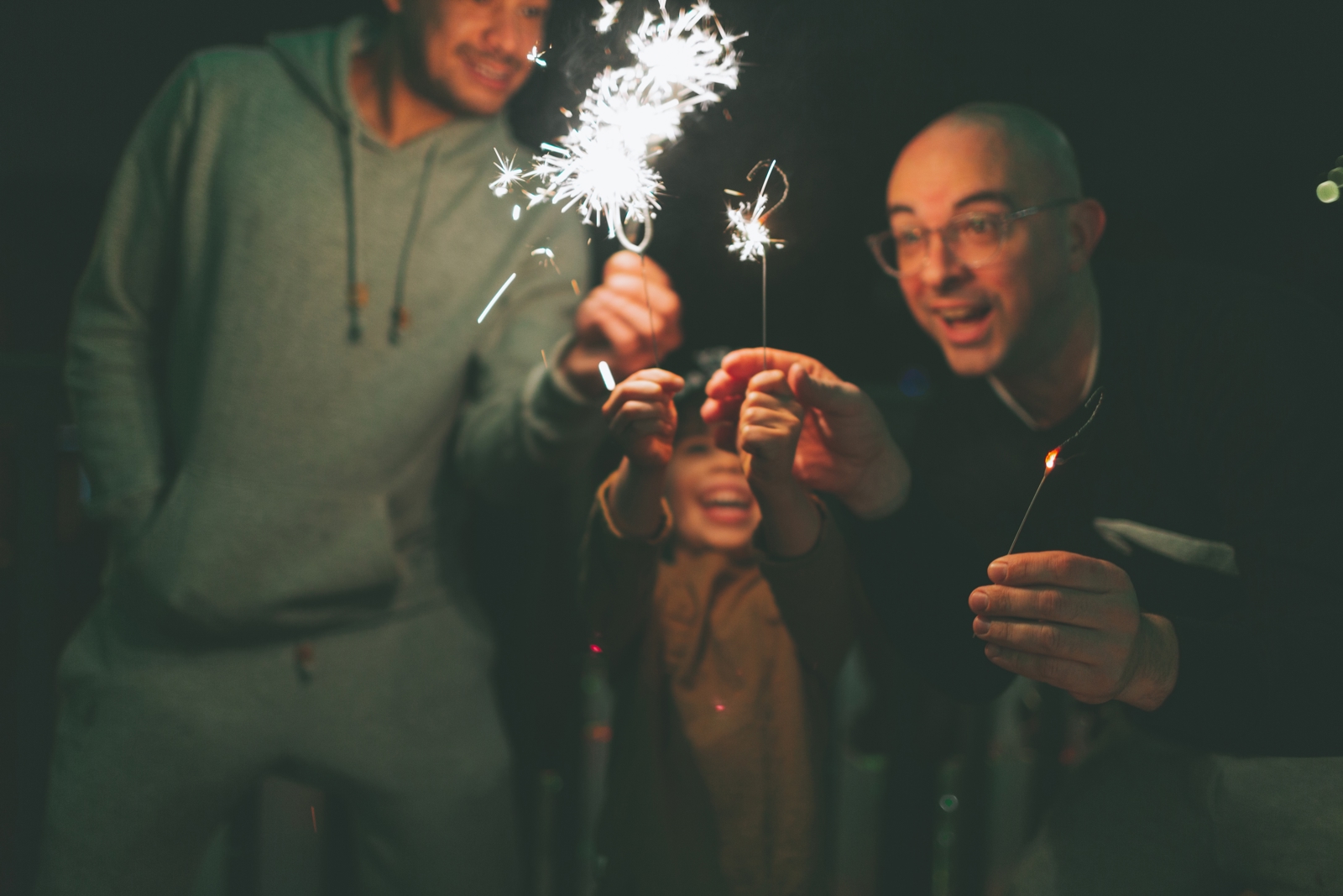 A Family Holding Sparklers At Night 2023 11 27 05 35 19 Utc