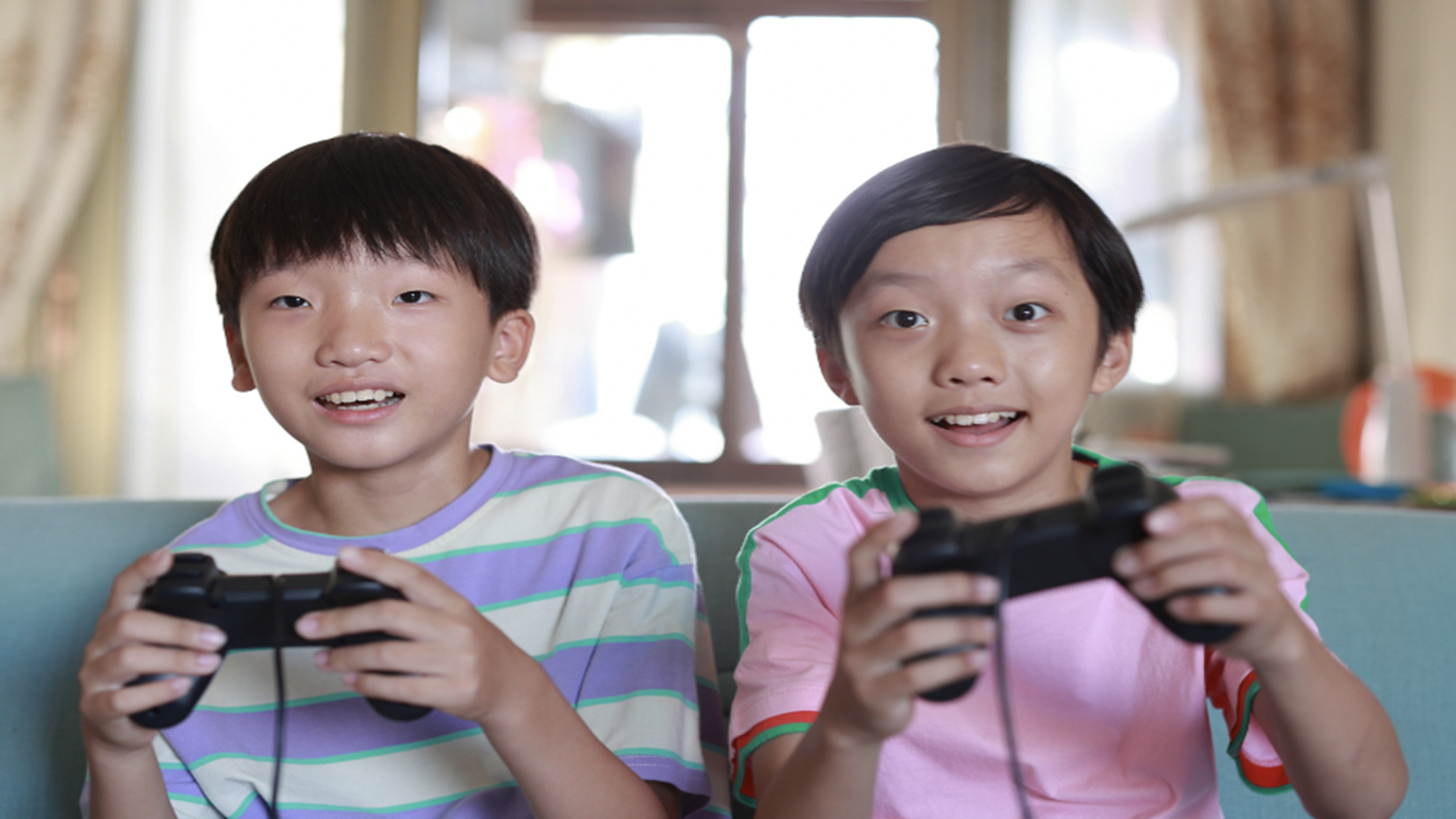Two Kids Playing Video Games